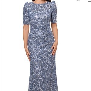 Xscape full length formal gown. Size 14p. NWT. Light blue with sequins.
